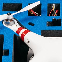 Drone and its parts are secured inside some foam protection.