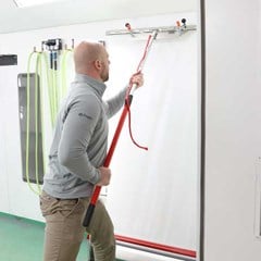 SprayMask paint booth film being applied