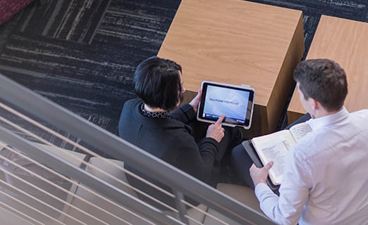 Pregis Employees working on tablet